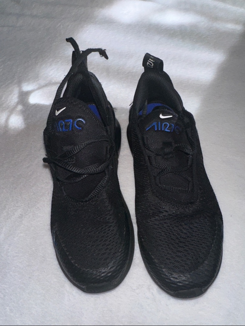 Nike Kids Black Sneakers with Blue Logo Accents